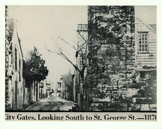 Pen and ink drawing of an old photograph showing St. George Street from in front of the Parades Dodge House, looking North, 1874