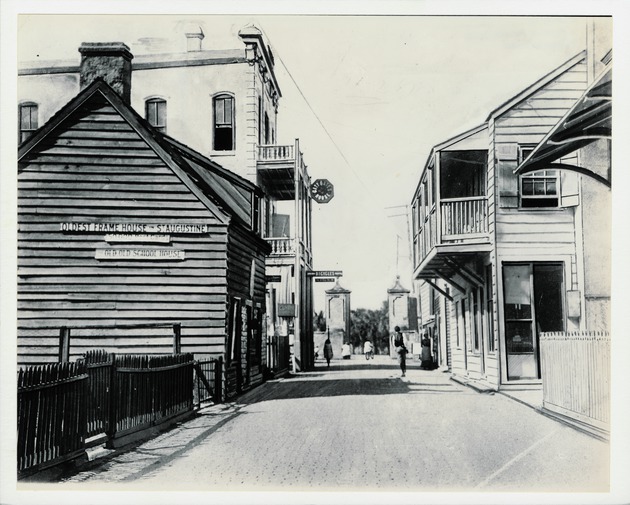 A view of St. George Street with a horse-drawn cart in front of the Rodriguez-Aver-Sanchez House on the left and the De Mesa Sanchez House on the right, looking North, 1963