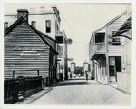 [1963] A view of St. George Street with a horse-drawn cart in front of the Rodriguez-Aver-Sanchez House on the left and the De Mesa Sanchez House on the right, looking North, 1963