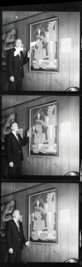 Man standing next to painting in Government House during the Contemporary Mexican Art exhibit, 1967