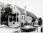 [1969] Northeast corner of Government House from the sidewalk on Cathedral Street near the intersection with St. George Street, looking Southwest, 1969