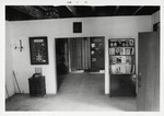 The entry room of the Gallegos House (with the front door on the right), looking East, 1973
