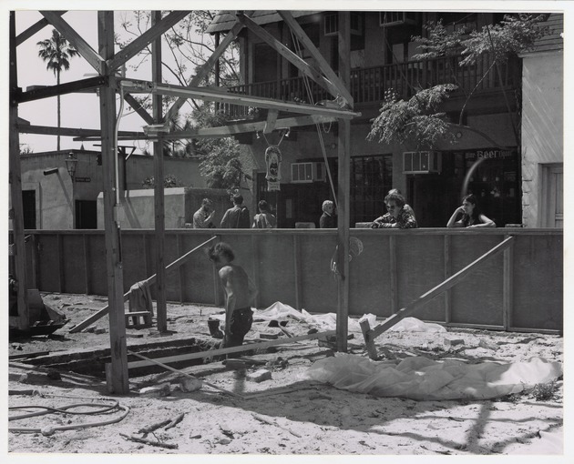 Construction of the Peso de Burgo House, framing the structure with spectators watching from St. George Street, looking Southwest, ca. 1973