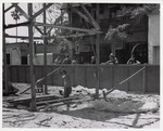 [1973] Construction of the Peso de Burgo House, framing the structure with spectators watching from St. George Street, looking Southwest, ca. 1973