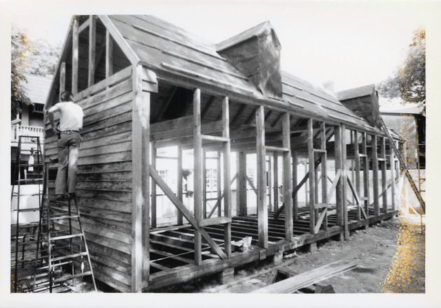 Constructing the Peso de Burgo House, cladding the South gable end, view from the rear yard, looking Northwest, 1973