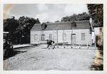 The poured foundations for the North and South outbuildings behind the Peso de Burgo House with framing started on the North outbuilding, looking West, 1973