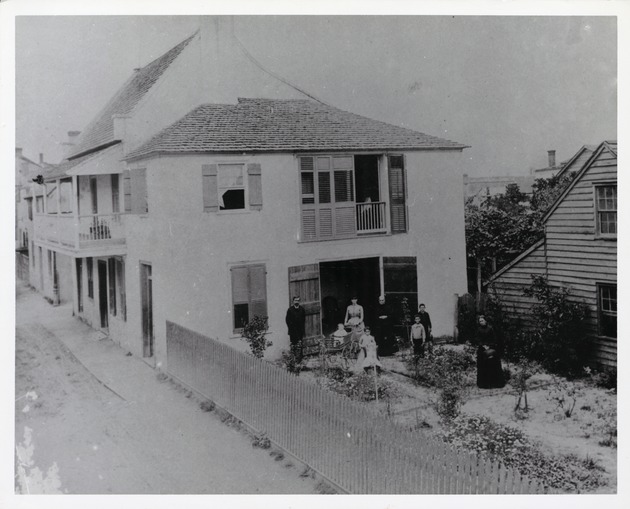 Historic image of the Benet family in the side yard of the Benet House, from across St. George Street, looking Northeast, ca. 1890