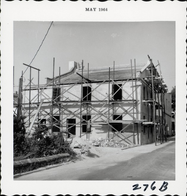 Reconstruction work on the Benet House from Cuna Street, looking Southwest, 1964