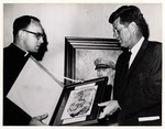 [1963] Dr. Michael Gannon presents President John F. Kennedy with a framed copy of the oldest writted record from St. Augustine (1565) at MacDill Air Force Base in Tampa, Florida, November 18, 1963