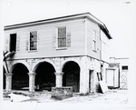 [1968] Southeast corner of the Peña-Peck House with exposed coquina on loggia arches from the courtyard during restoration, looking North, 1968