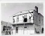 [1968] Removing the balcony on the South side of the Peña-Peck House during restoration, looking Northwest, 1968
