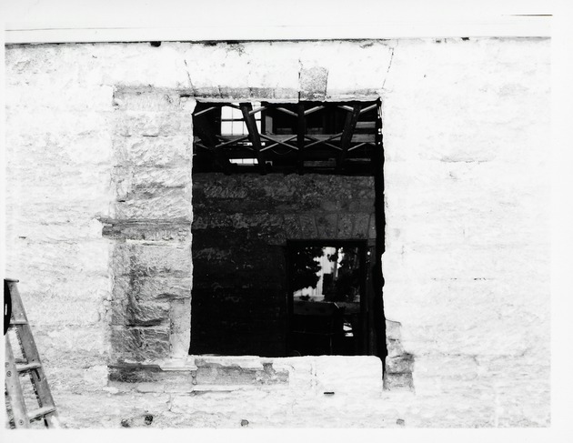 Looking in through the Peña-Peck House through a window during restoration, 1969