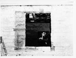 [1969] Looking in through the Peña-Peck House through a window during restoration, 1969