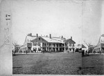 Half of a stereoview of the U. S. Barracks, from the parade grounds looking Northwest, ca. 1864