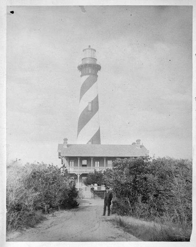 St. Augustine Lighthouse and Lightkeepers House with man standing along a dirt road in leading to the house, looking West, ca. 1876