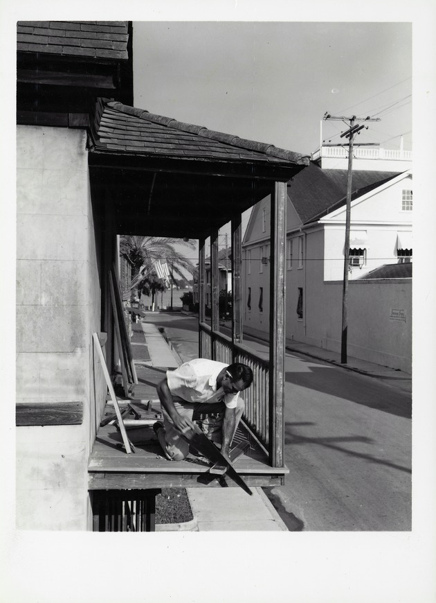 Billy Sanchez working on the Balcony of the Tovar House, looking East, 1960 - 