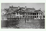 [1875] Uniformed troops standing in formation on the parade ground in front of the St. Francis Barracks, looking Northwest, ca. 1875