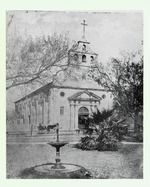 The Cathedral from the Plaza de la Constitucion with a fountain in the foreground, and picket fence around the yard of the Rectory (to the west of the Cathedral), looking Northeast, ca. 1870