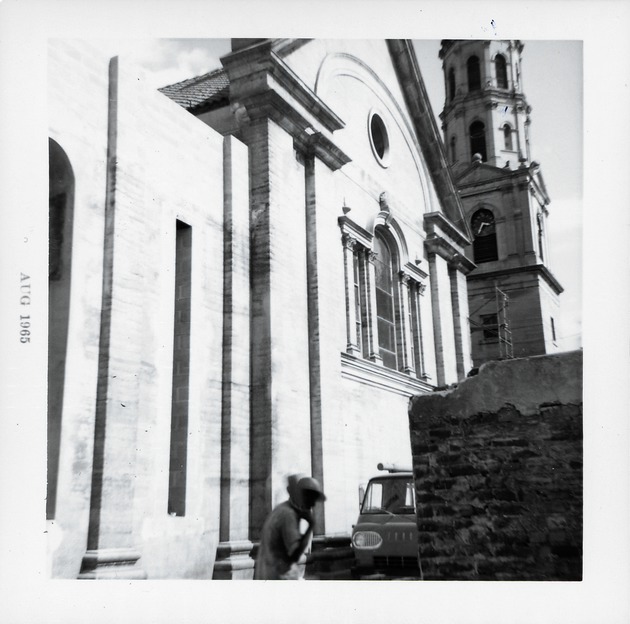 Exterior of the Cathedral Basilica during restoration and demolition of the Rectory, showing the old walls to the west of the Cathedral, 1965 - 