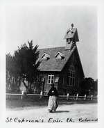 [early 1900's] A woman walking in front of St. Cyprian's Episcopal Church on Center Street (today, Martin Luther King Jr. Blvd.) looking Northwest, ca. early 1900's