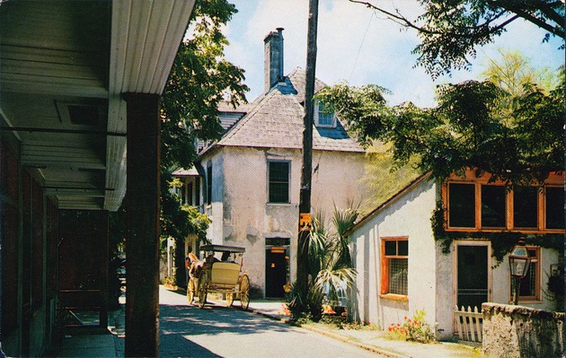 A postcard showing a horse-drawn carriage on Aviles Street in front of the Ximinez-Fatio House, looking Southwest, ca. 1963 - Front