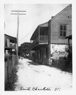 [1900] A small boy crossing Charlotte Street, south of Bridge Street, looking North, ca. 1900