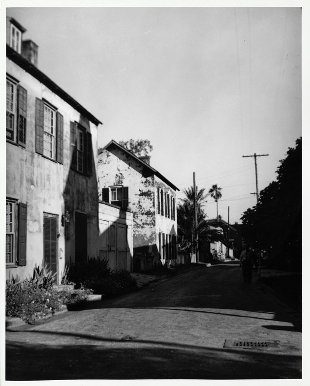 The Sanchez House (left) and Marin House (right) along the east side of Marine Street seen from the intersection with Bridge Street, looking South, ca. 1960's