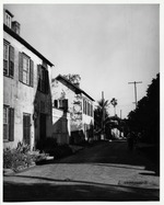 The Sanchez House (left) and Marin House (right) along the east side of Marine Street seen from the intersection with Bridge Street, looking South, ca. 1960's