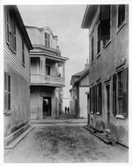Two men standing at the end of Treasury Street as seen from the intersection with Charlotte Street, looking East, ca. 1886