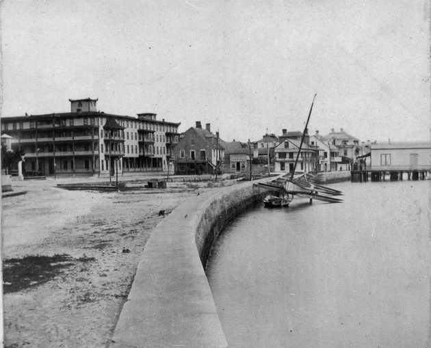 St. Augustine waterfront at the boat basin with the yacht club on the right, most of these wooden structures were destroyed in the 1887 fire, looking North, ca. 1880