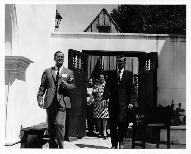 Mayor Fernando Suarez of Aviles (left) and Bradley Brewer (right) entering the courtyard of the Ribera House, looking East, 1969