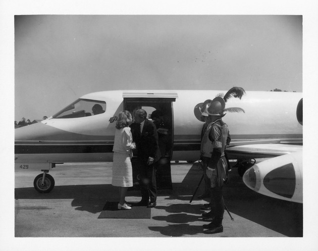 Ambassador Arguelles arrives at the airport - Exiting the plane and greeting May Lou Whitney 