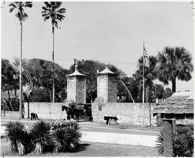 A horse-drawn carriage riding through the City Gate (prior to the reconstruction of the Cubo Line), looking Northwest, 1961