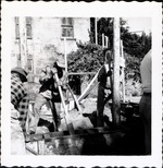 [1963] Tamping the tabby walls in wooden forms during construction of the Gallegos House