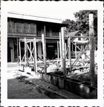 [1963] Southwest corner of the Gallegos House under construction, looking across St. George Street to Parks Hotel
