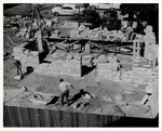 [1962] Construction of the coquina walls of Salcedo House from the balcony of the Arrivas House, looking North