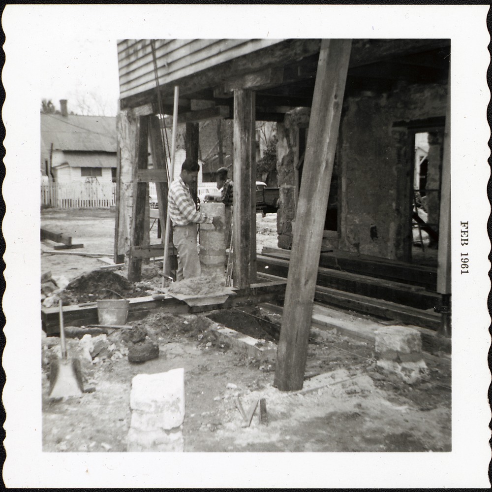 Constructing coquina pillars for the South loggia, looking Northwest, 1961