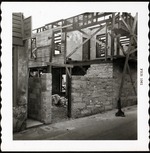 [1961] Construction of the gateway courtyard entrance to Arrivas House off St. George Street, looking Northwest, 1961