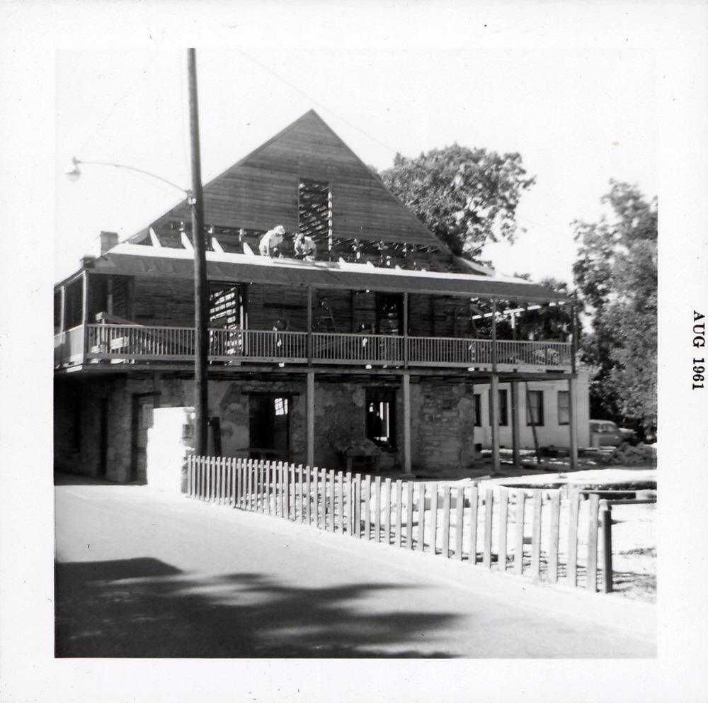 North elevation of Arrivas House during restoratio, finishing the balcony, looking Southwest, 1961