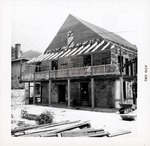 [1961] Northern elevation of Arrivas House during restoration, working on the balcony, looking Southeast, 1961