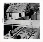 [1962] Constructing the grape arbor over the coquina well behind Arrivas House, from the balcony looking Northwest, 1962
