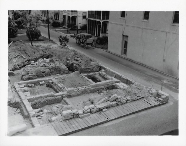 Archaeological excavations prior to the reconstruction of Oliveros House with original foundations exposed, view down Cuna Street, looking Southeast