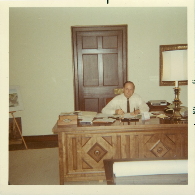Earle W. Newton working at a desk, St. Augustine Historial Restoration and Preservation Commission Member]