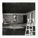 [1967] Applying stucco to the interior first floor walls of the Benet Store, 1967