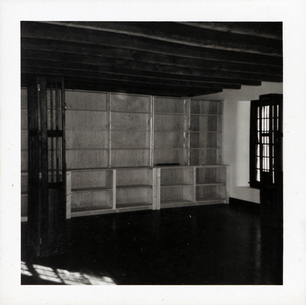 Installing the display cabinet and shelving in Benet Store, 1967