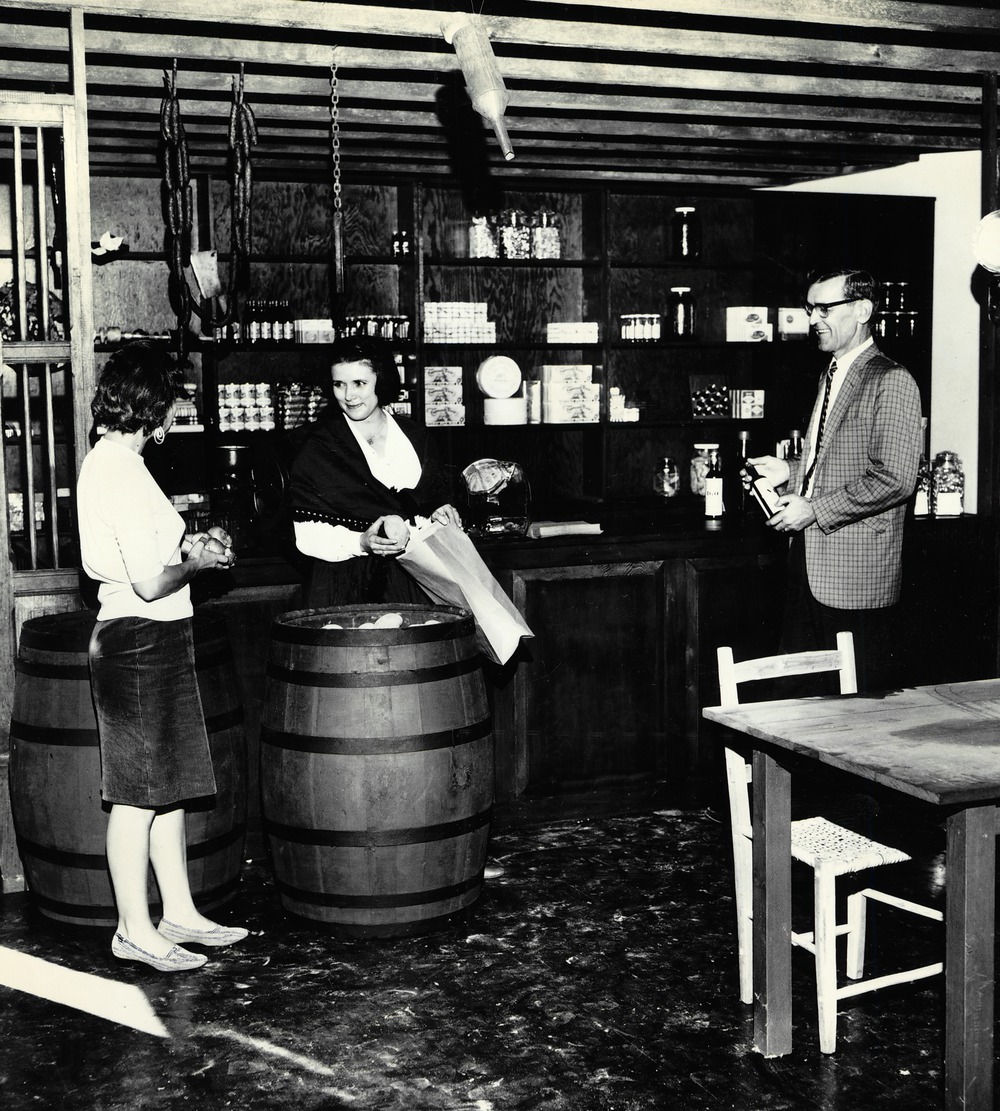 Rita O'brien (left), Jeanne Kiser (center), and Bradley G. Brewer (right) pose in the Benet Store for a promotional photograph, 1967