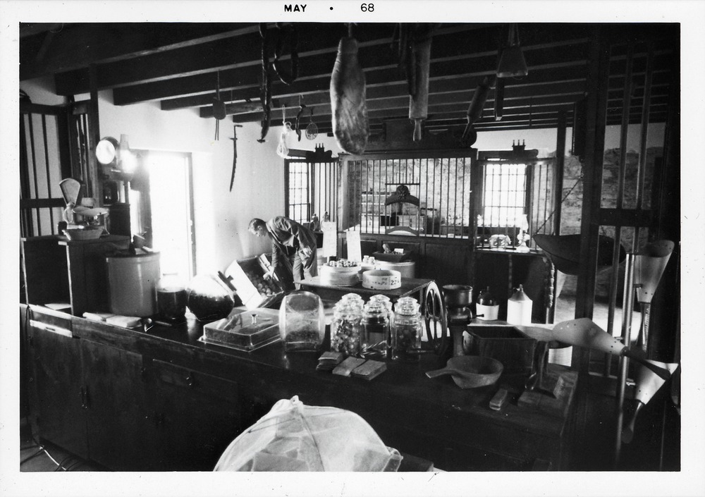 View of the interior of the Benet Store from behind counter, looking East, 1968