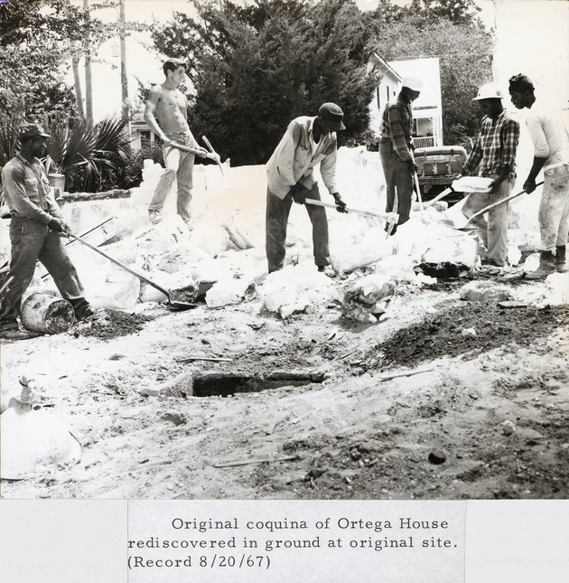 Workmen excavating coquina from previous a struture for use in the reconstruction of the Ortega House