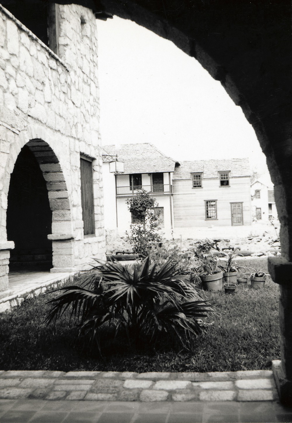 The back (English-period addition) of the Marin-Hassett House from the loggia of the Casa del Hidalgo, looking North, 1965