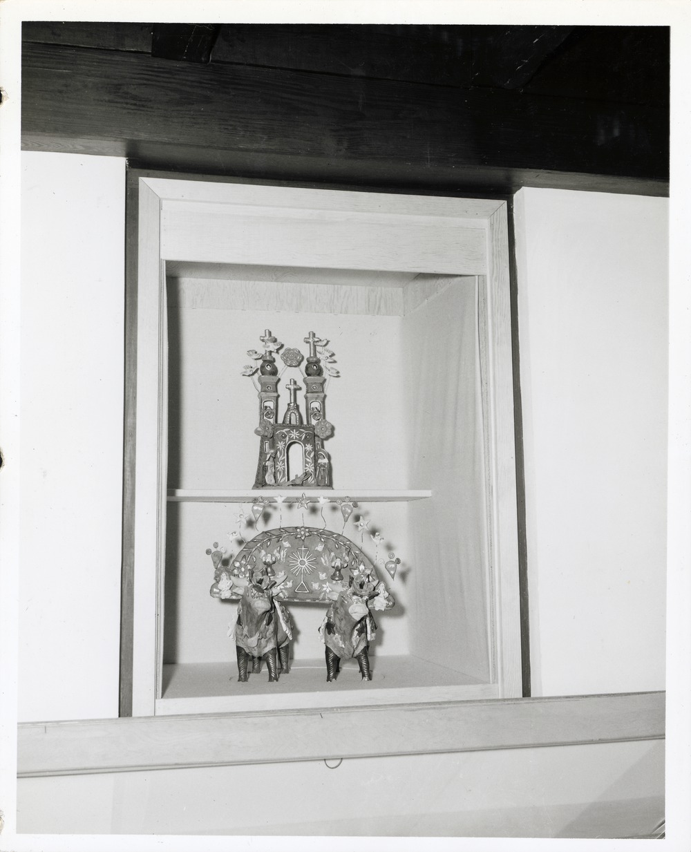 Religious artifacts in a display case at the Marin-Hassett House (Pan American Center), 1966